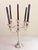 A commanding example of Art Nouveau decorative metalwork, this antique Italian silver-plated five-arm candelabra channels...
