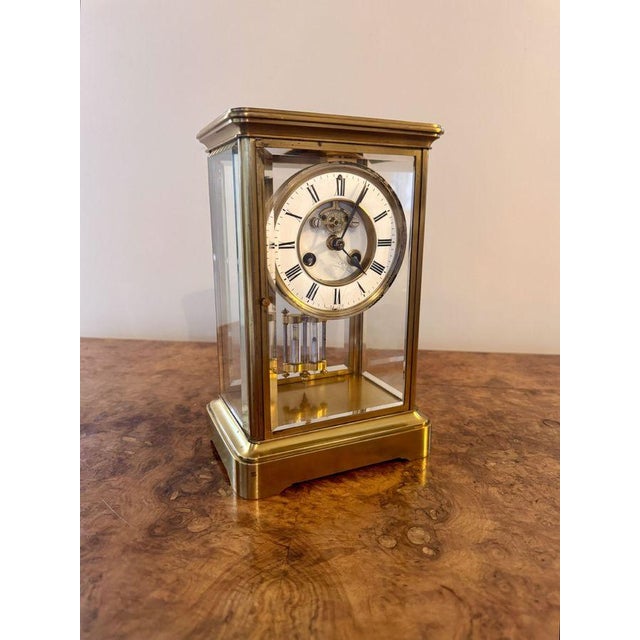 Fine quality antique Victorian brass mantle clock, having a quality antique 19th century mantle clock with a brass case...