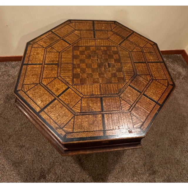 Handcrafted vintage game table featuring an extraordinary inlaid surface created from thousands of individually placed...
