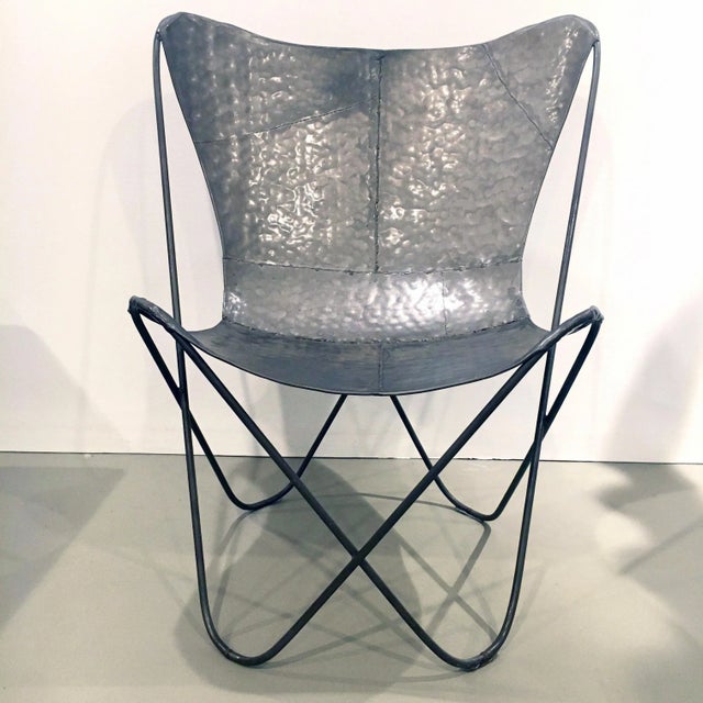 An incredibly unique hammered and welded metal artist interpretation of the classic 1938 Butterfly Chair by the architects...