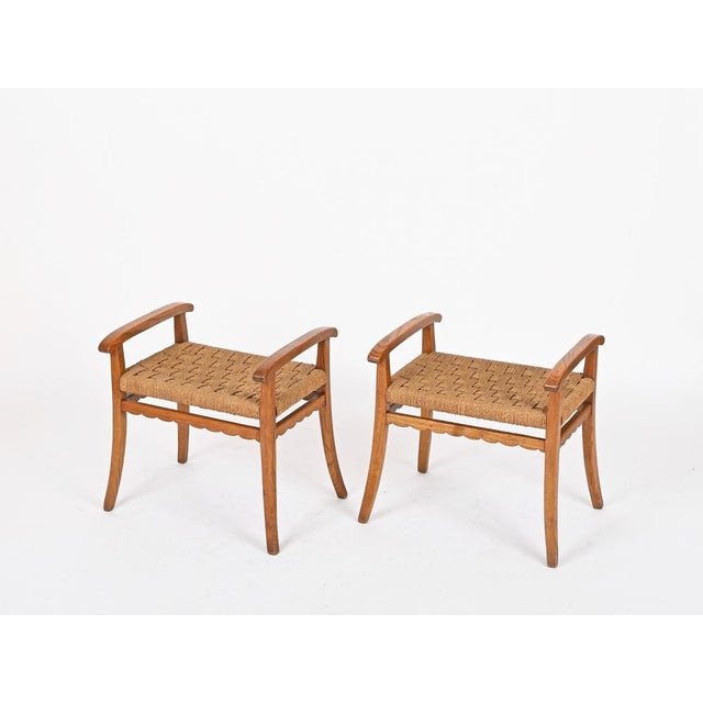 Marvelous and unique pair of stools entirely crafted in solid oak and completed by beautifully hand-woven rope seats....