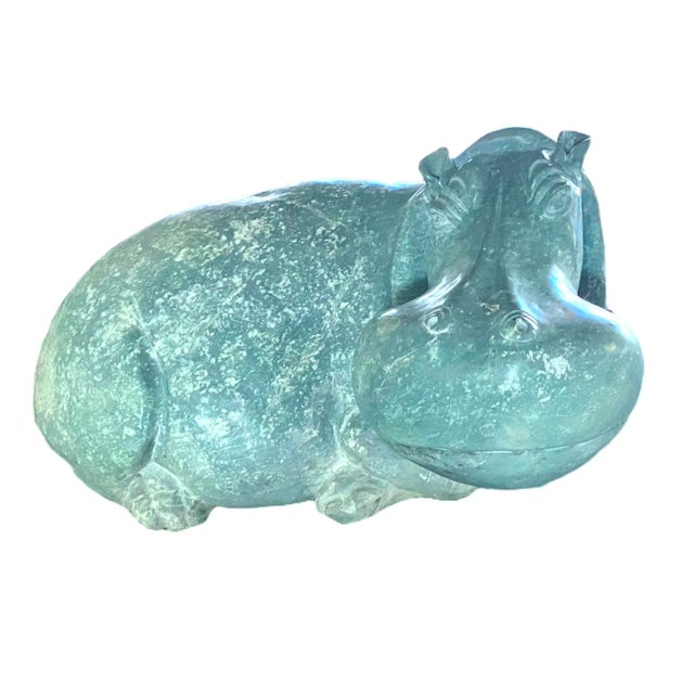 A large sculpture from the Shona school, Zimbabwe Africa. The hippopotamus is carved from serpentine and has a blue/green...
