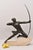 Antique Sculpture, 1930s, shows a Warrior an Archer with bow and arrow expressing strength and power. The work proposed...