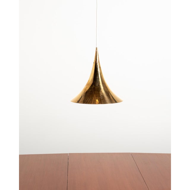Brass pendant lamp with a flared conical shape. Arvid Böhlmarks Lampfabrik, Sweden, mid-20th century. Brass pendant lamp...