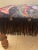 Adorable heavyweight antique wood footstool with a bright moody abstract floral fabric. Most likely recovered in the 80s....