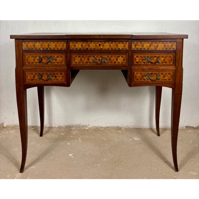 Elegant Spanish writing desk from the 20th century, crafted in fine wood and richly decorated with geometric marquetry...
