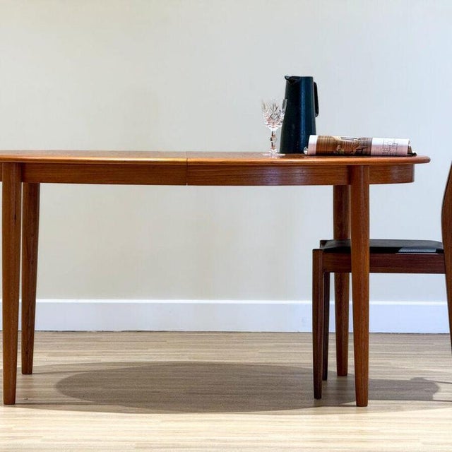 An exceptional Danish dining table designed by Johannes Andersen and handcrafted in Denmark during the 1960s by Skovmand &...
