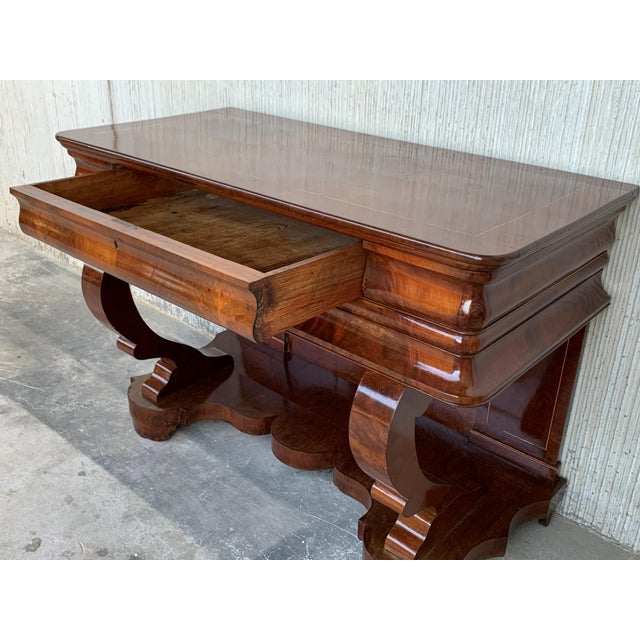 About Absolute unique walnut wall console table artfully made in the early Biedermeier period circa 1830 in Austria. Made...