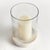 With a hammered glass vessel that sits inside a simply marble tray, this hurricane is decidedly modern. The hammered glass...