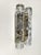 Elegant pair of wall lights by Doria Leuchten, Germany, featuring textured clear ice glass shades mounted on metal...