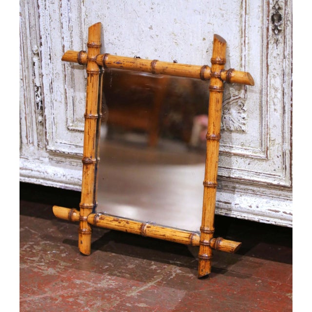 Add warmth and character to a powder room, entryway, or gallery wall with this charming antique faux bamboo mirror....