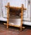 Add warmth and character to a powder room, entryway, or gallery wall with this charming antique faux bamboo mirror....