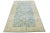 Beautiful hand-knotted antique Agra wool rug with a blue color field. This Indian rug has beige accent colors in an all-...