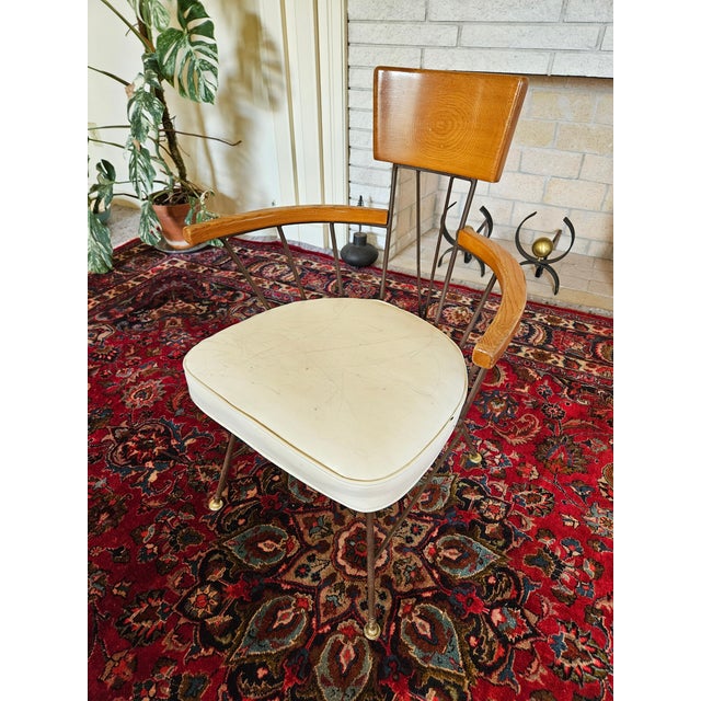 An MCM Richard McCarthy by Selrite Attributed, Wrought Iron and Oak Wood Arm Chair with White vinyl cushion seat.