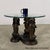 (Please note: glass top not included). A whimsical yet sculptural bronze table base featuring three stylized dachshunds...