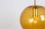 A special round dark yellow glass pendant designed by peill & putzler, manufactured in germany, circa 1970s. High quality...
