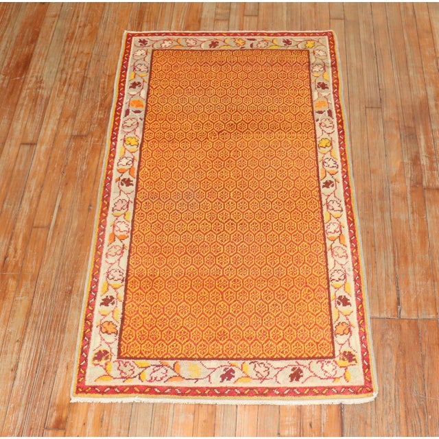 Orange peel colored Midcentury Turkish Anatolian rug.