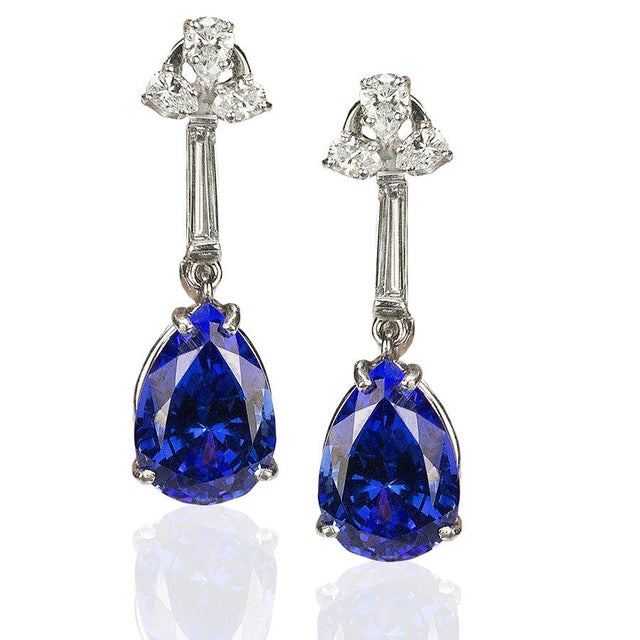 Platinum Earrings with 2 pear shape matching Tanzanites weighing 9.59 carats ans 1.01 carats of fancy shape diamonds....