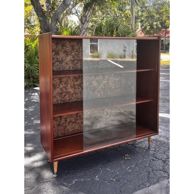 Mid-century modern bookcase or display case by Lane Furniture. A beautiful vintage display shelf. Four blonde mid-century...