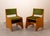 Set of Spanish Mid-Century chairs from the 1960s, made of wood. The chairs rest on two large side panels that support the...
