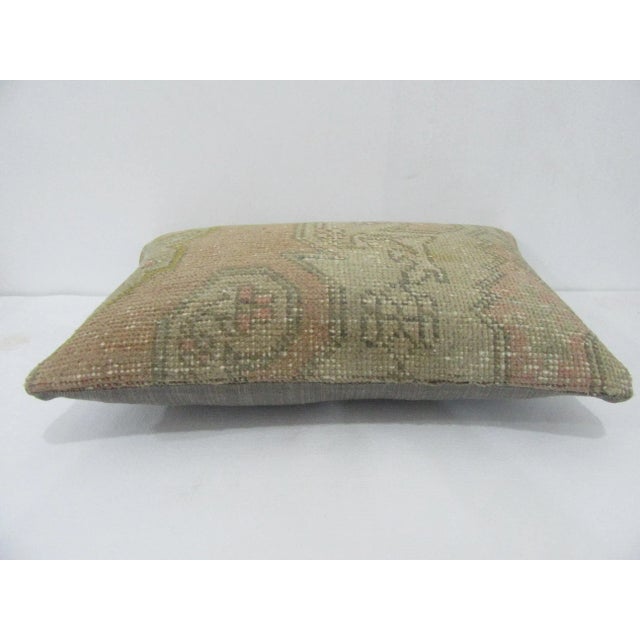 Decorative pillow cover made from a vintage Turkish handknotted rug. Backed with good quality cotton fabric. Pillow...