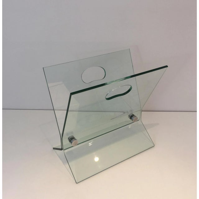 In the style of François Arnal. Glass and brushed steel design magazine rack, French, circa 1970.