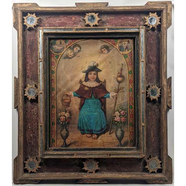 An extraordinary Spanish Colonial devotional retablo featuring an intricately painted depiction believed to represent the...