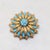 1960s textured goldtone round and marquise faux-turquoise brooch with security clasp. Marked "© PANETTA" on the back....