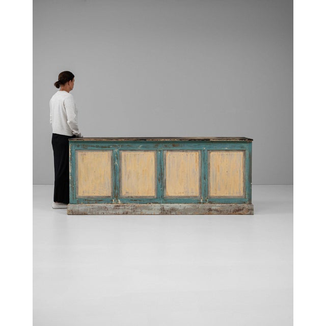 Here is a cabinet, its teal/cream painted distressed finish, paneled front the first thing to catch the eye. It was made...