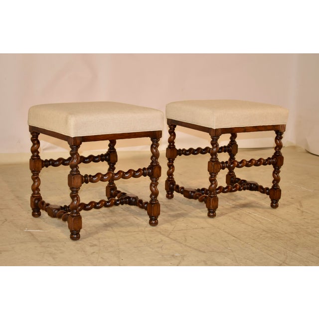 Pair of 19th century oak stools from France with newly upholstered seats in linen, finished with a single welt. The frames...