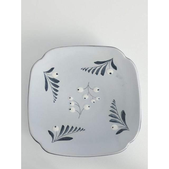 Scandinavian modern french blue, hand-painted plate with floral motif designed by Eva Jancke-Björk for Bo Fajans, Sweden....