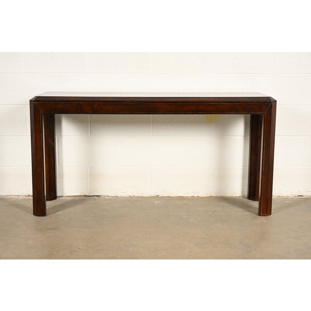 A gorgeous Regency leather wrapped console table or sofa table By Maitland Smith Circa 1970s Measures: 56"W x 16"D x...