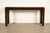 A gorgeous Regency leather wrapped console table or sofa table By Maitland Smith Circa 1970s Measures: 56"W x 16"D x...