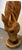 Carved from a single piece of Red Oak hardwood, showing natural grain patterns, knots, and warm amber tones. The mane...