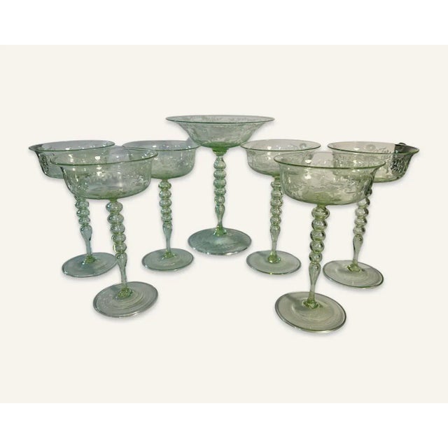 This 7 piece compote set by Vittorio Zecchin is in pale green and etched with scenes of birds, flowers and early 18th...