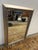 Design Plus Gallery presents a Silver Triple Beaded Wall Mirror from Uttermost. The mirror is encased in a wooden frame...