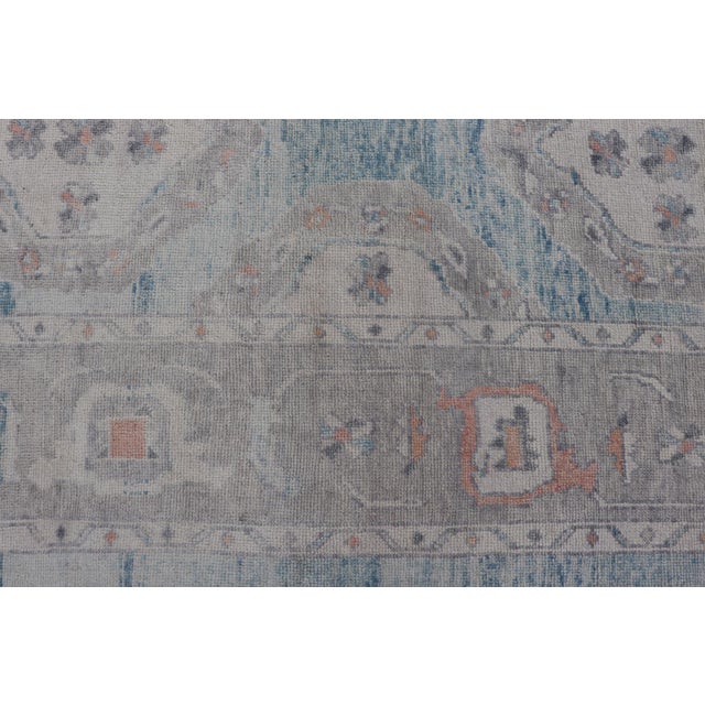 All-Over Tribal Motifs Design Light Blue With Hints of Orange Turkish Oushak Rug For Sale - Image 9 of 12