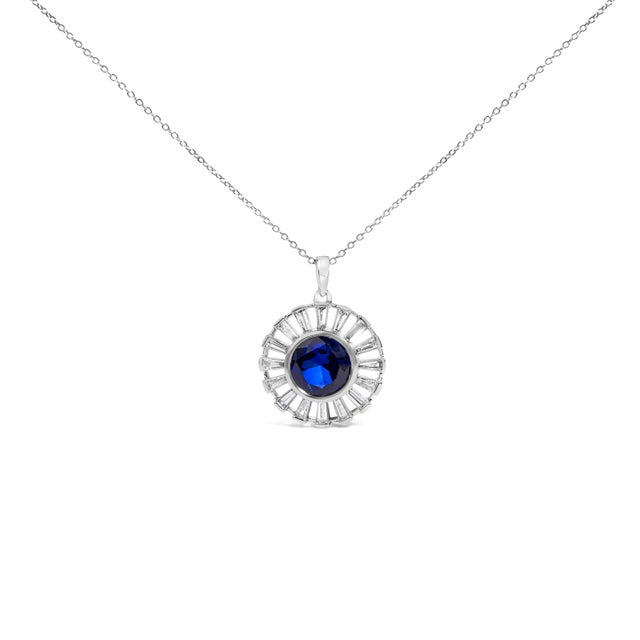 A luminous talisman for everyday radiance, this round medallion glows with a 9 mm lab‑created blue sapphire, heat treated...
