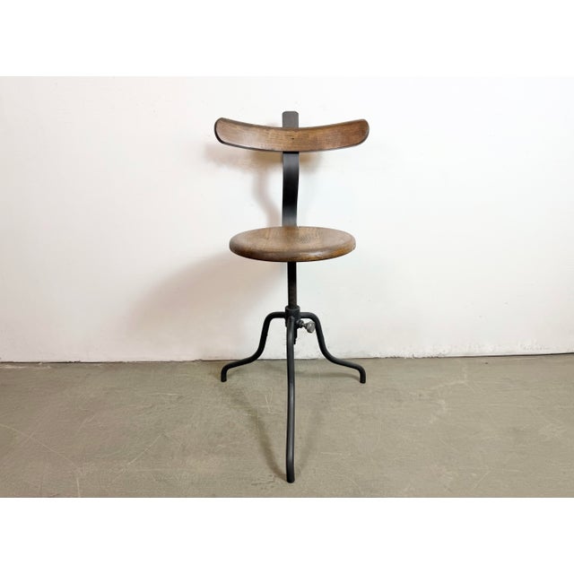 Industrial height adjustable swivel chair made in former Czechoslovakia during the 1950s.The construction is made of black...