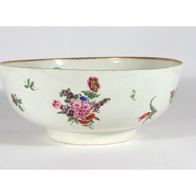 Botanical Brilliance: A First Period Worcester Porcelain Floral Bowl Circa 1770 This substantial porcelain bowl is a...