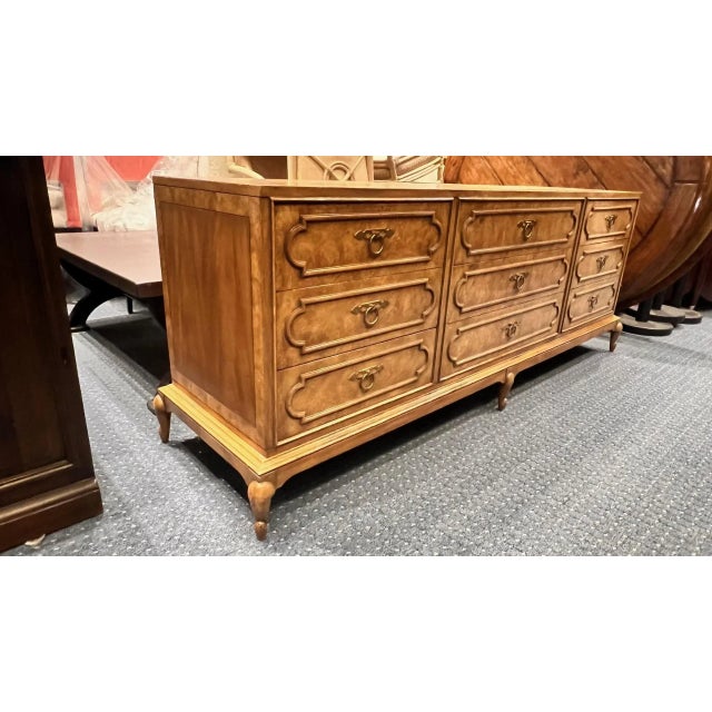 A beautifully crafted 1970s dresser by Mastercraft Furniture, showcasing the brand’s signature use of richly figured...