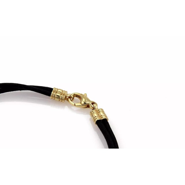 This is a chic authentic bracelet from Bvlgari, it is crafted from 18k yellow gold with a polished finish. The centerpiece...