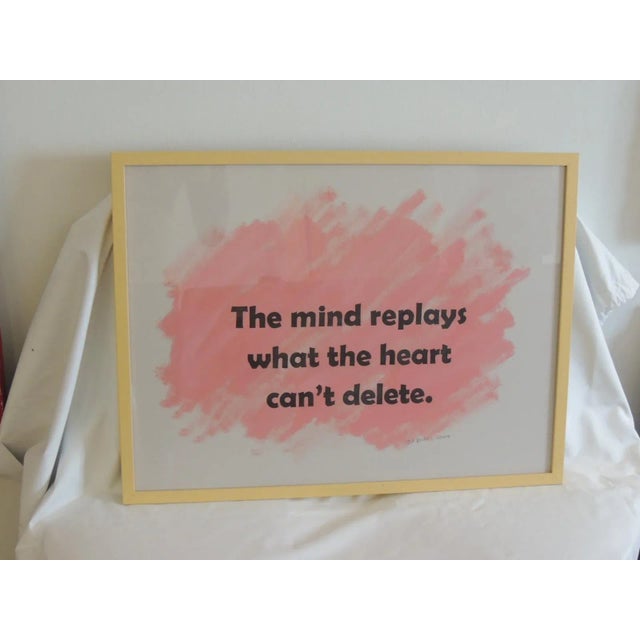 Framed Word Art Print on Paper By Ted Baker Art Work. Pink and black composition. Framed on yellow tone wood frame and...