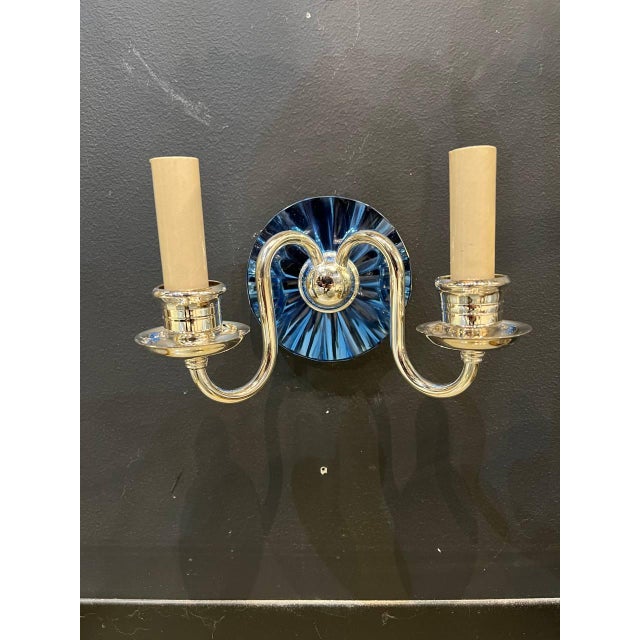 Circa 1930’s French silvered plated 2 lights sconces with cobalt mirror backplate.