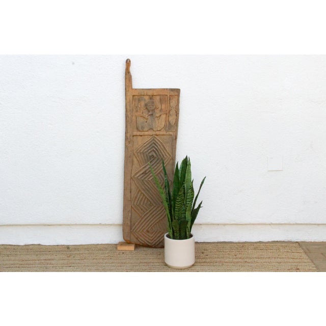 This 47-inch door (55 inches including its pivot lug) is a single-slab Igbo piece, sometimes attributed to the Awka...
