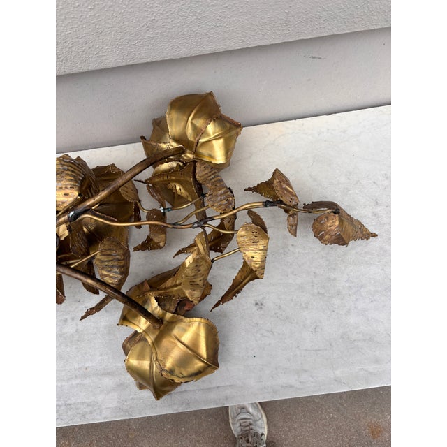 Large metal sconce with flowers and leaves, circa 1960. 34 inches Height.