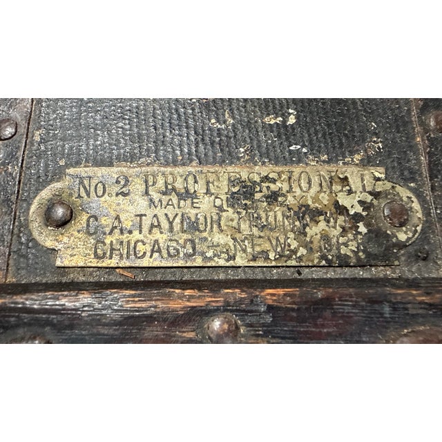 This rare antique miniature 19th century handmade iron and brass mounted wooden steamer trunk by Taylor Trucks is a unique...