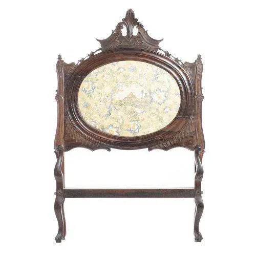 18th century Portuguese, in rosewood with carvings. Backrest with central medallion upholstered in damask fabric....