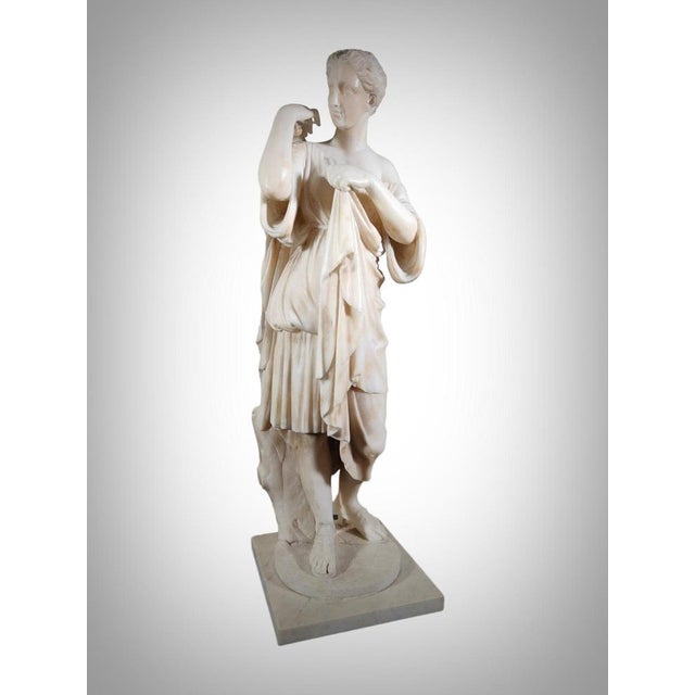 It is the sculpture of a woman covered with a draped chiton, probably representing the goddess Artemis and traditionally...