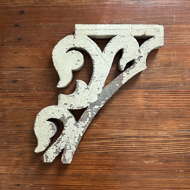 A gorgeous, antique wood corbel fragment. Features a scrolled, swan head bracket detail with a distressed finish in...